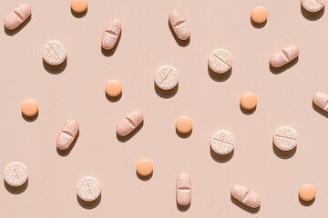 Nature colors pills on a peach fuzz color background