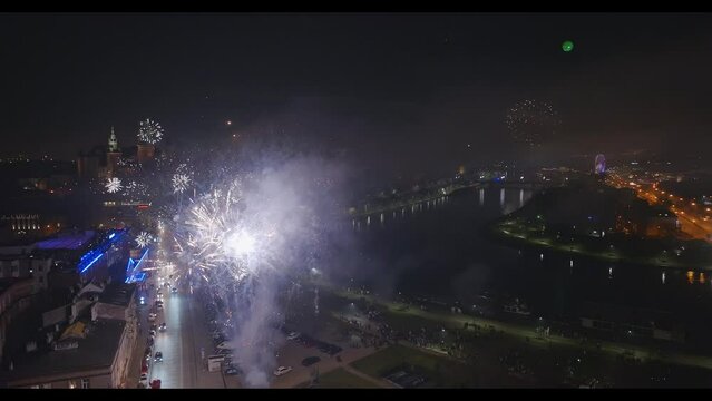 New Year's fireworks over the old town and castle. Krakow, Poland, Europe. Shots from a drone.