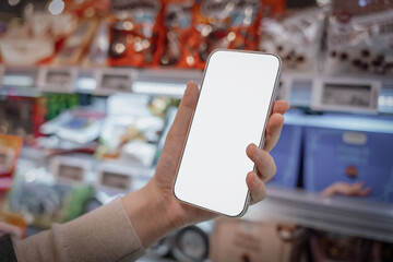 Modern supermarket shopping consumers touch blank smartphones to make purchases..