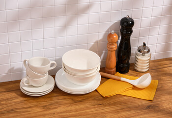 Ceramic crockery and various spices, condiments. Modern dinnerware and household.