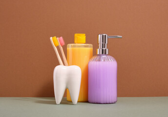 Toothbrushes for personal healthcare. Bright gel and glass soap dispenser.
