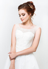 Young pretty caucasian bride in wedding dress