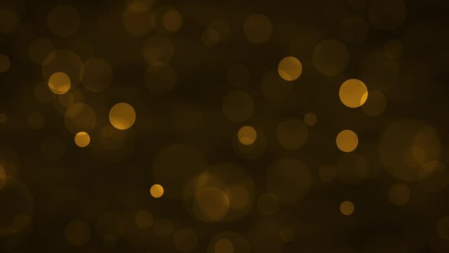 Golden glowing bokeh particles animation.Gold and brown background.Moving bubbles colorful blurred animation backdrop.christmas and valentine's day background.	
