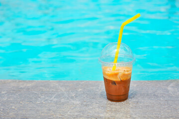 Iced coffee on outdoor poolside
