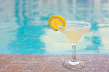 Cocktail glass on outdoor poolside