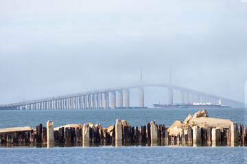 The Sunshine Skyway bridge covered in foggy clouds (Interstate 275 in Florida) - Powered by Adobe