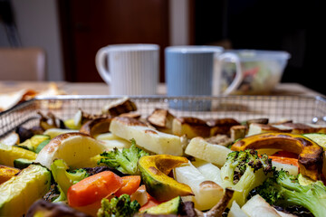 Delicious grilled vegetables are placed on the table. Enjoy a healthy meal with an air fryer
