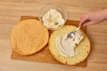 Adding the filling to the cake. Cooking a festive pie at home
