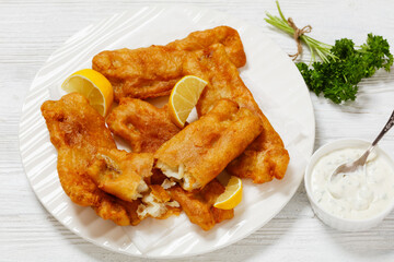 deep fried crispy beer batter fish fillet on plate