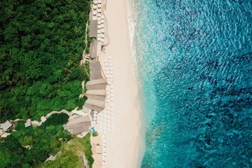 Poster Paradise beach with turquoise ocean and resort in Bali. Aerial view © artifirsov