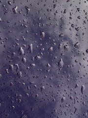 Raindrop reflecting light on a dark background