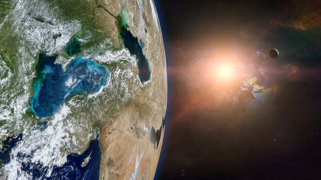 View of Earth planet in outer space with sunlight. Elements of this image furnished by NASA.