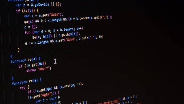 Code. Colorful jsx javascript computer programming code scroll close up pixel detail shot 4K super macro on screen.