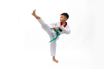 Practice side Kick. kids karate martial arts. Taekwondo uniform with green belt. Portrait Thai...