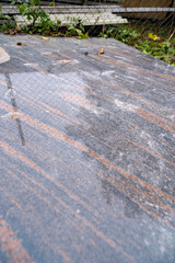 polished granite slab. Hallandia granite from Sweden. Brown stone with gray veins texture