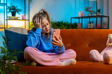 Child girl use smartphone, playing game, loses becoming surprised sudden lottery results, bad news,...