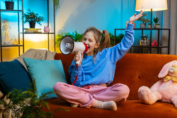 Preteen child girl talking with megaphone, proclaiming news, loudly announcing advertisement,...