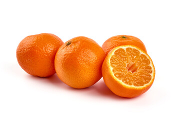 Ripe tangerines with leaves, isolated on a white background.