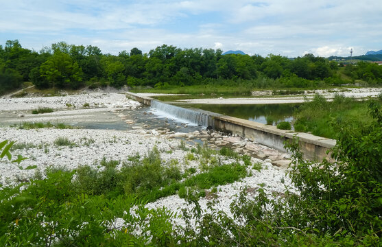riverbed with a small waterfall and water without people in the valley