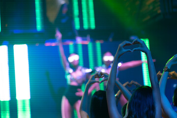 Close up hand love or mini heart. Nightlife and disco dance party concept. Sexy woman people and...