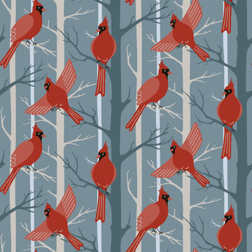 Red cardinal birds seamless pattern. Northern cardinal birds and trees silhouettes on blue background. Winter surface pattern design with flying forest birds for fabrics, wallpaper, wrapping design
