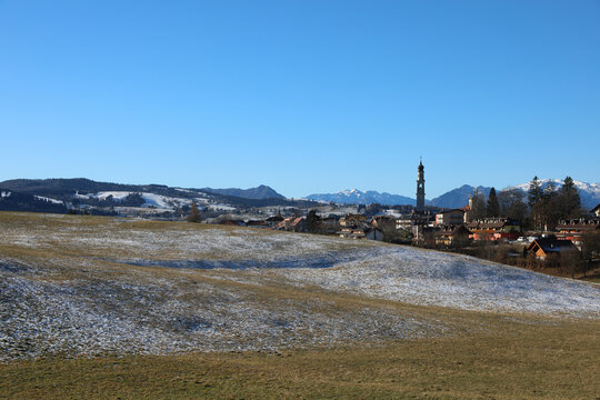 landscape of the mountain plateau and the town of CANOVE with meadows with little snow in winter in Italy