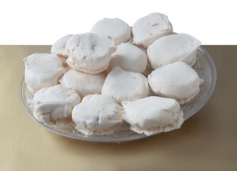 Fototapeta na wymiar very tasty white meringue cookies close up