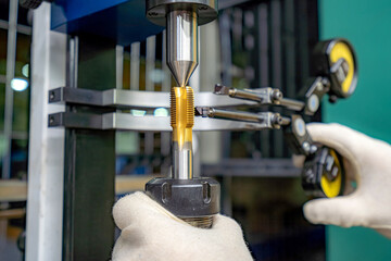 A machine for checking cutters and cutting tools for runout in the centers using indicators.