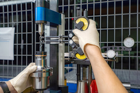 A stand for checking cutters and cutting tools for runout in the centers using indicators.
