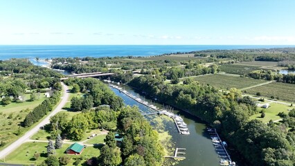 Beautiful green countryside landscape with Apple farm growing in New York State in summer season under blue sky