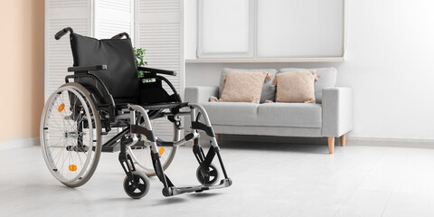 Modern empty wheelchair in living room