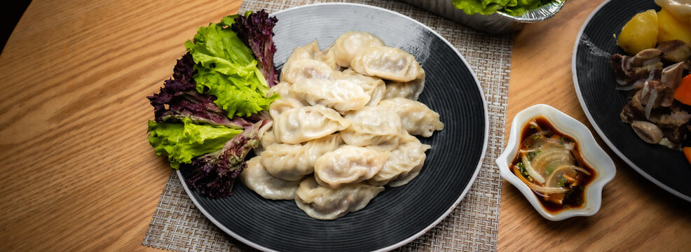Tsagaan Sar table with Mongolian food, mongolian national food, mongolian traditional food buuz asian lunar year food, Buuz, dumping