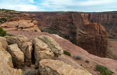 Fototapeta na wymiar Desert landscape, view of red eroded rocks, Canyon de Chelly National Monument, Arizona