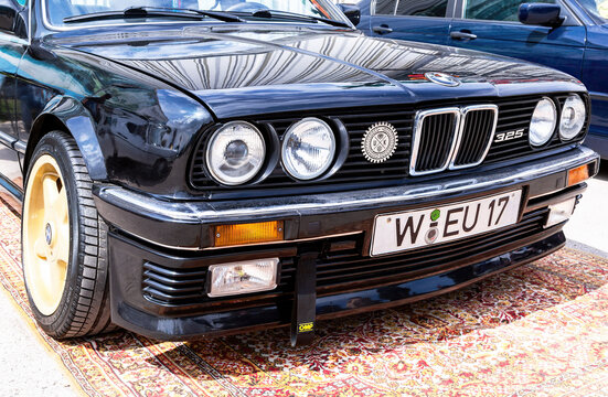 Front part of BMW 325 retro vehicle at a local car show