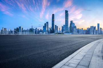 Empty asphalt road and city buildings landscape at night in Guangzhou