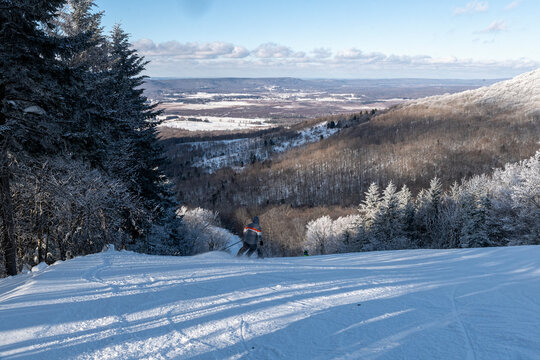 Downhill skier ging donw the mountain