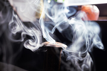 Wooden smoking Incense stick burner at home