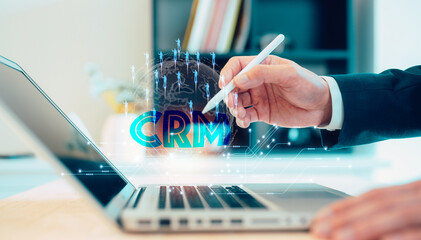 CRM Customer relationship management Businessman using computer laptop working with diagram for sales marketing technology