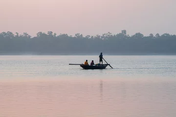 Papier Peint photo Gris foncé Beautiful Boat in river at dawn. Foggy landscape with boat during sunset on traditional boat in Sundarbans. 