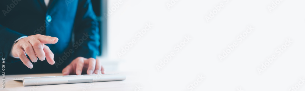Poster businessman hands pointing at something on virtual screen and typing on the remote wireless computer