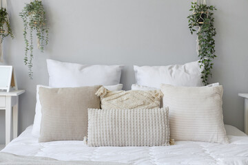 Cozy bed with soft pillows, closeup