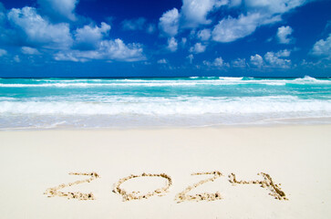 2024 year on the sand beach near the ocean