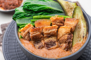 Crispy Pork Kare Kare (Peanut Sauce) with Vegetables and Shrimp Paste on the side 

