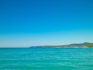 Fototapeta na wymiar Blue water of Tyrrhenian sea in Vada, Tuscany, Italy.