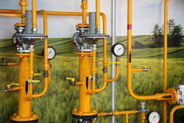 Natural Gas control pippeline installation with valves and manometers on green field background