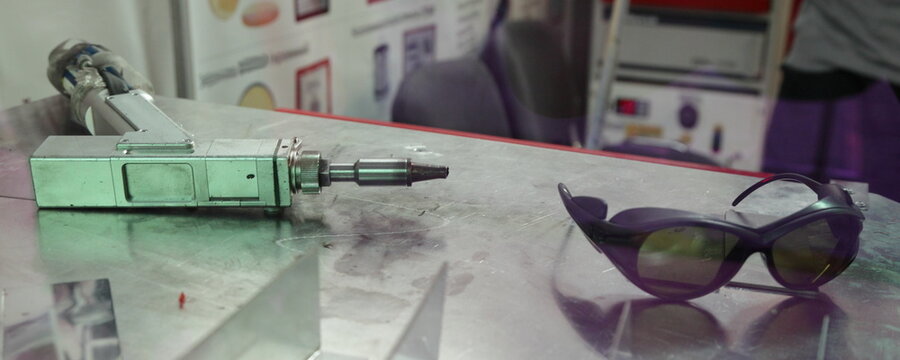 laser welding gun and safety glasses. Safety measures during welding operations