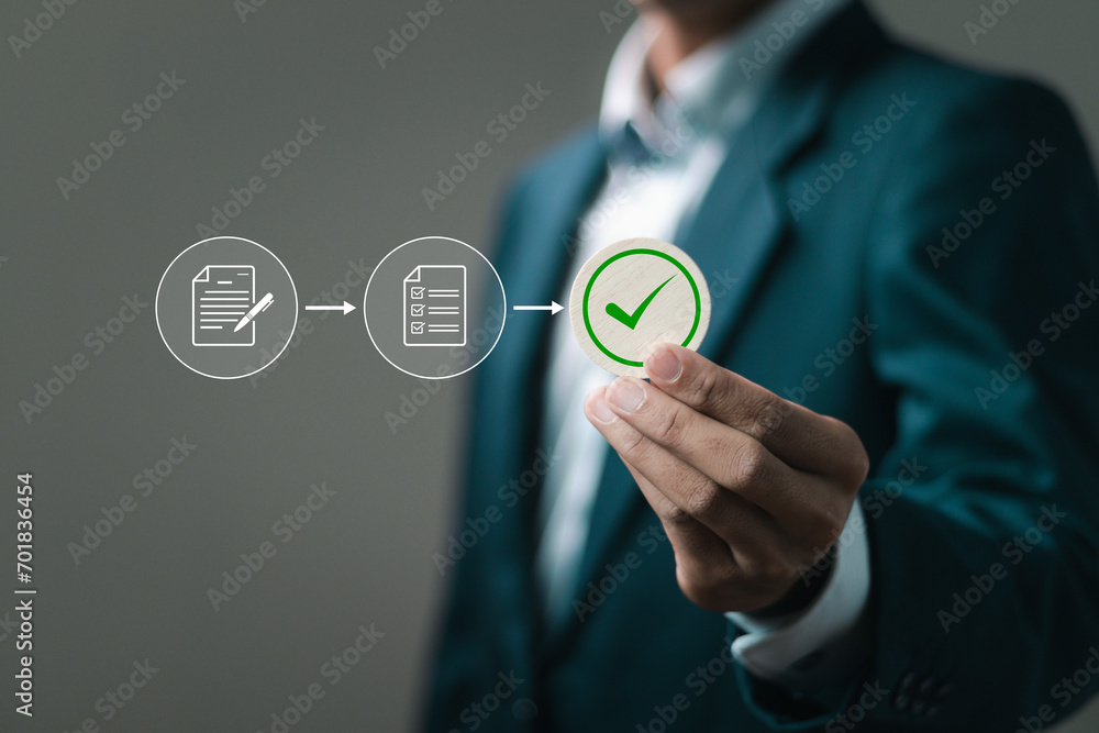 Poster businessman holds wooden blocks with correct marks to paperless online approval for business process