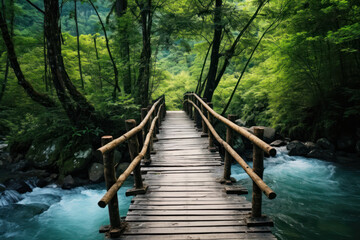 Rustic bamboo bridge crossing vibrant blue mountain river