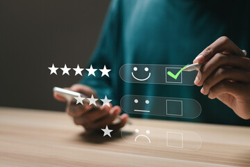 Customer satisfaction service concept. Businessman rate satisfaction by smiling face and 5-star satisfaction, on online application. satisfaction feedback review, good quality most. - obrazy, fototapety, plakaty