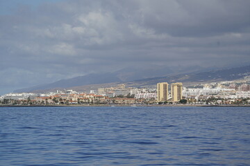 Fototapeta premium View of Puerto de Los Cristianos, seen from the boat. Tenerife island, Spain.